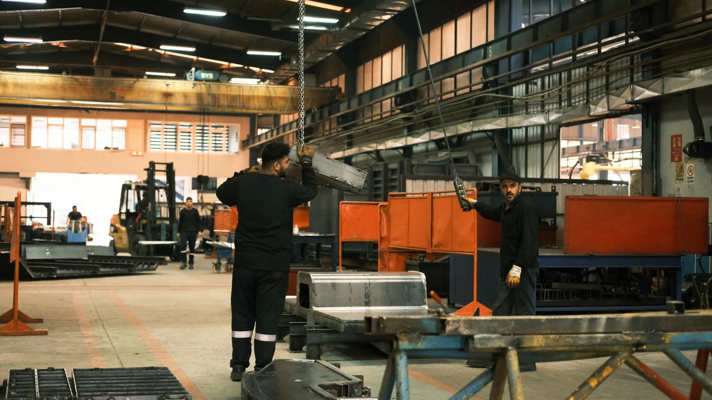 Workers on an automotive assembly line